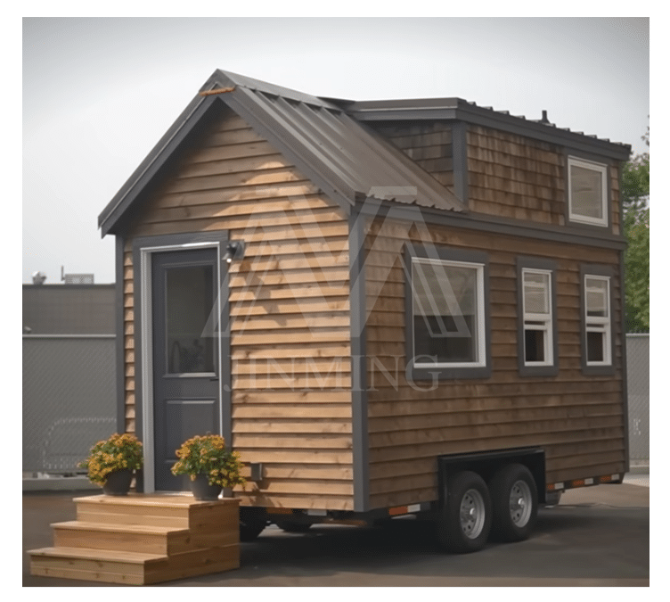 A Small Wooden Tiny House On Wheels With A Front Door, Steps, And Potted Flowers, Situated In A Parking Lot.