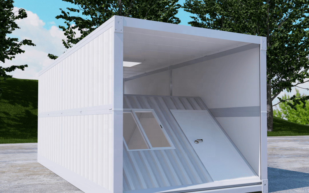 White foldable Container With An Open Side And Angled Window, Situated Outdoors On A Concrete Surface With Trees In The Background.